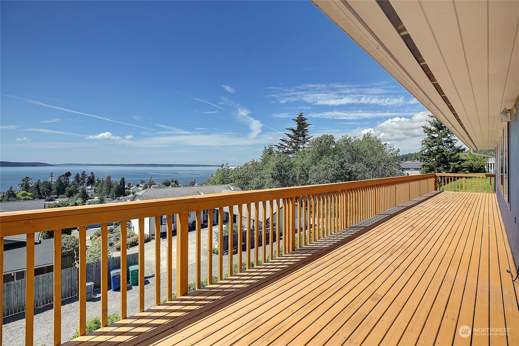 a view of a balcony with wooden floor