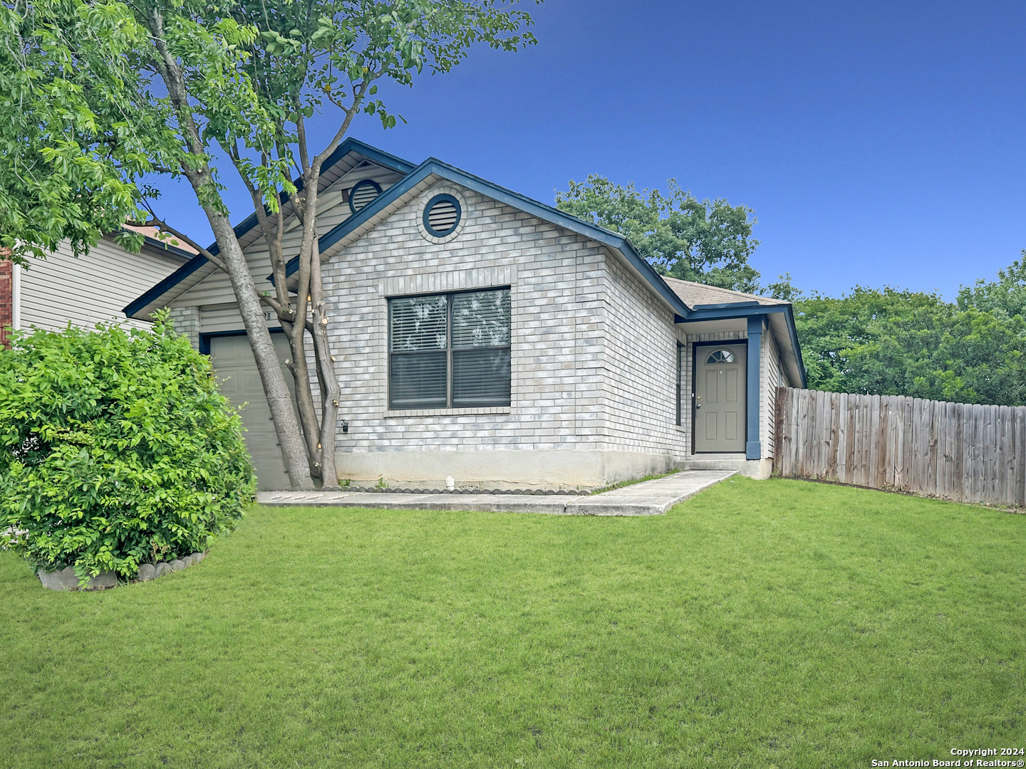 a front view of a house with yard