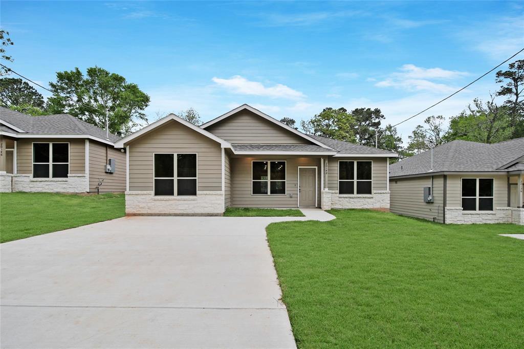 front view of a house with a yard