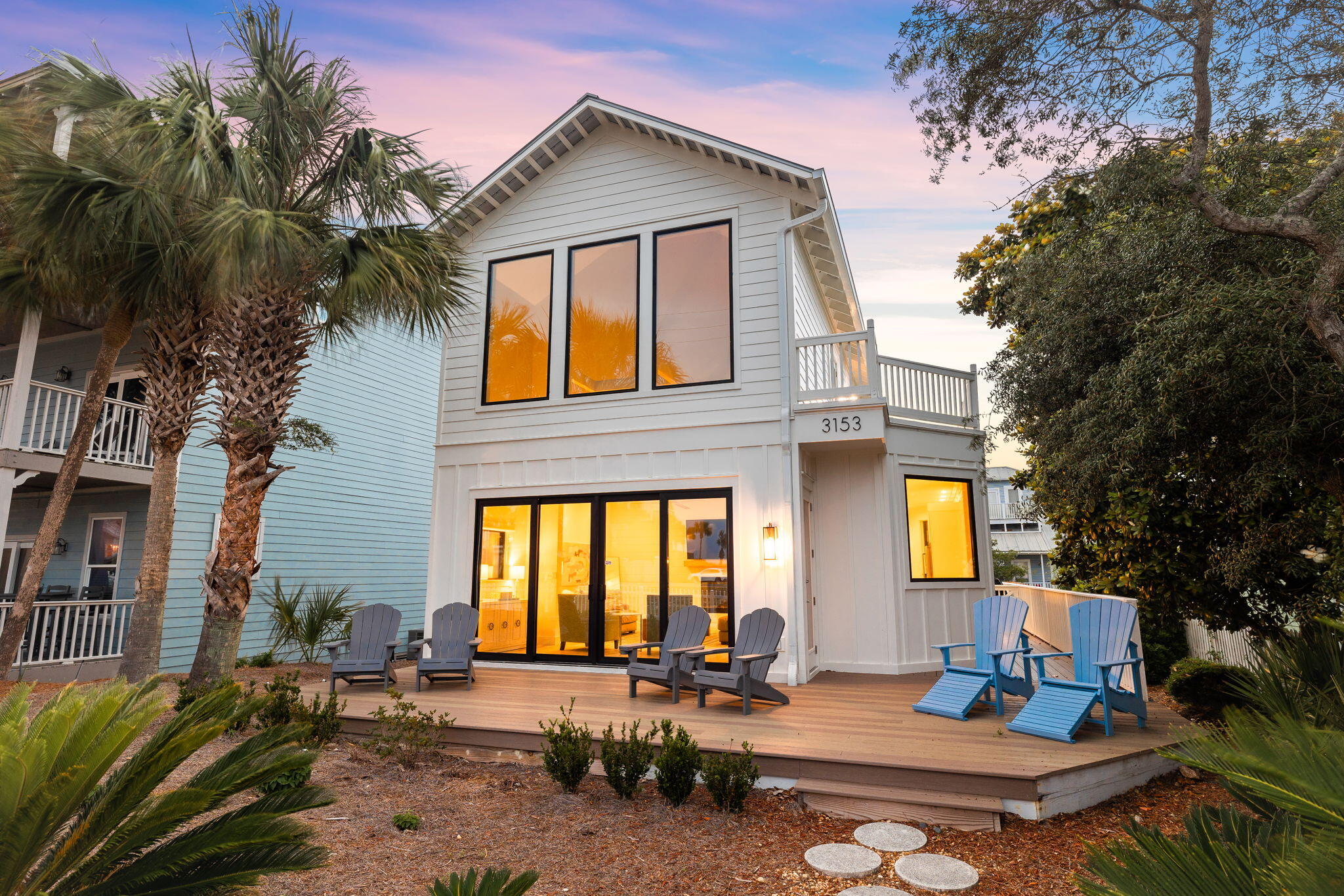 a front view of a house with outdoor seating