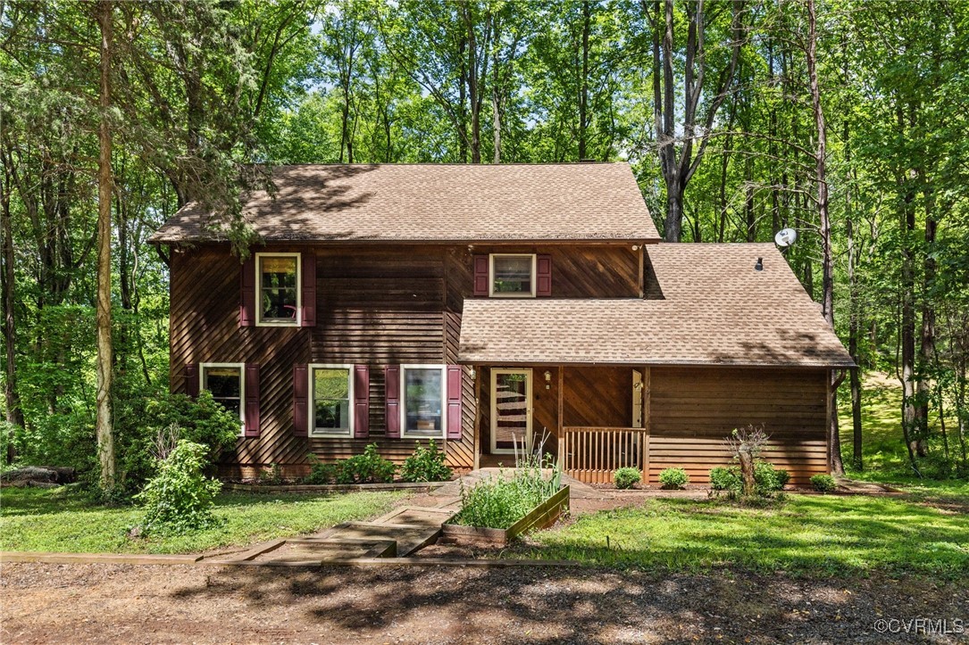 a front view of a house with a yard and porch