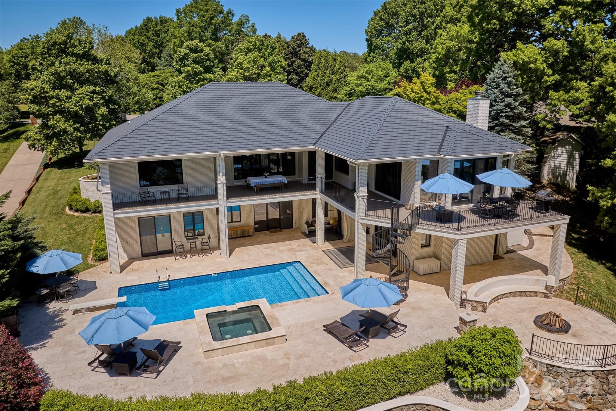 a view of a house with backyard sitting area and garden