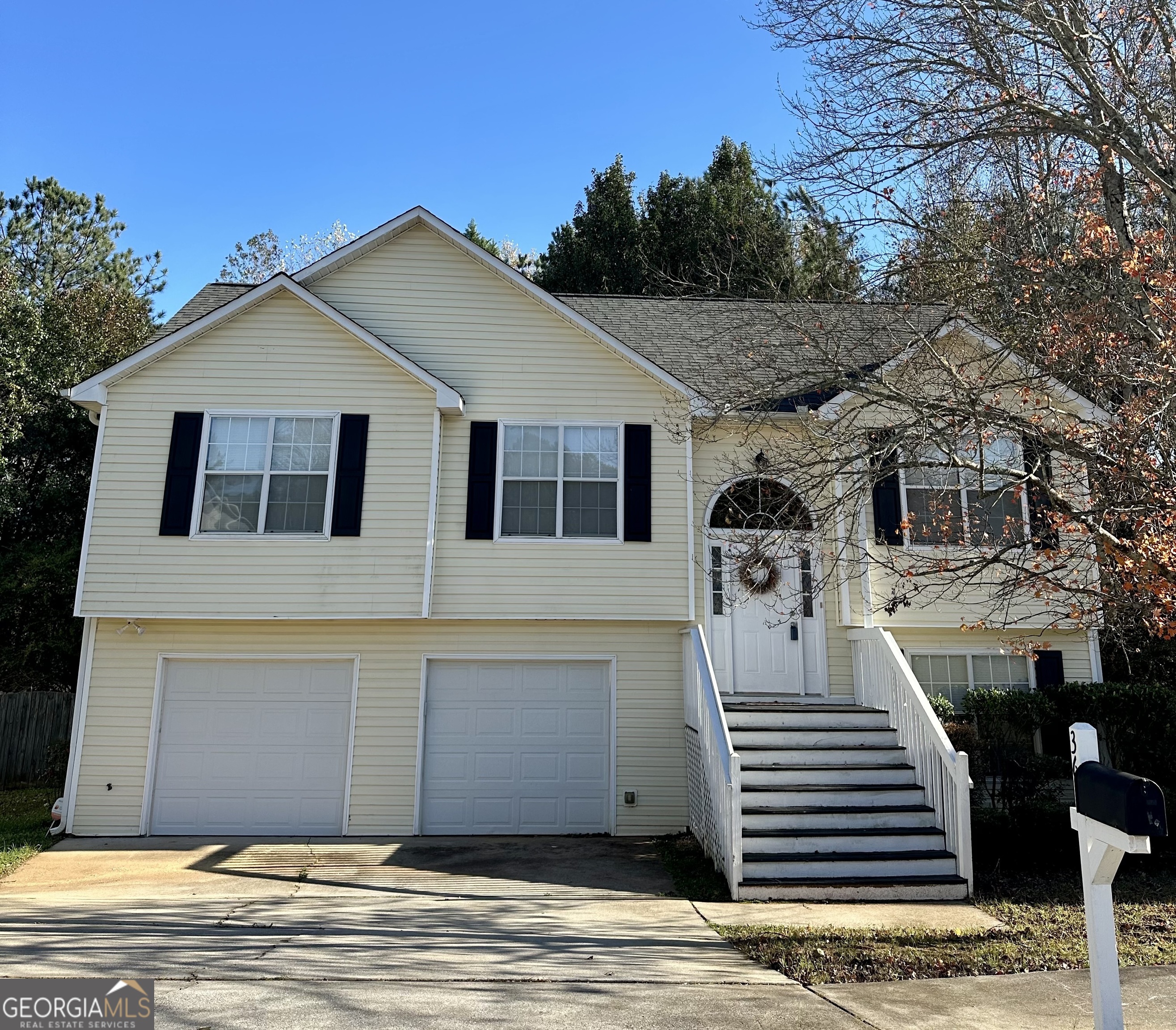 a front view of a house with a garage