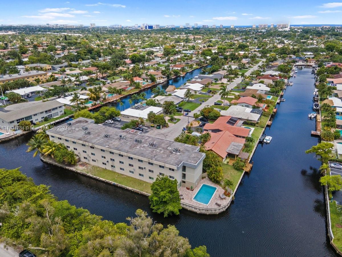 an aerial view of a house with a lake view