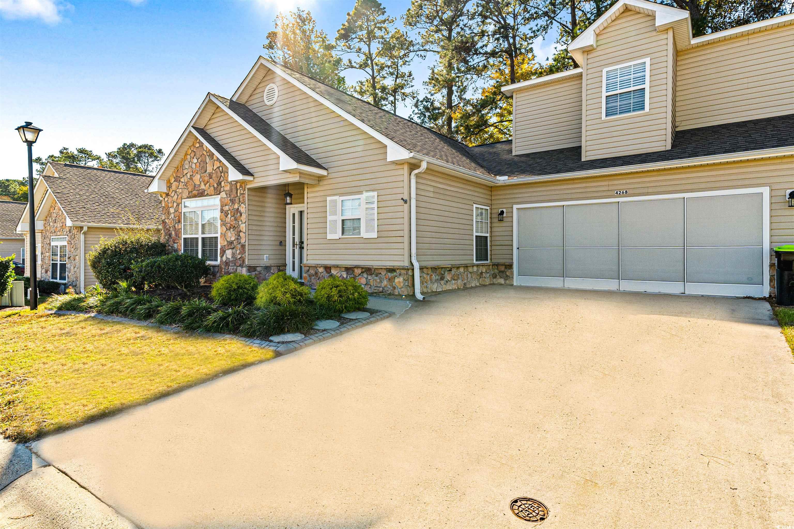 View of front of property featuring a front yard a