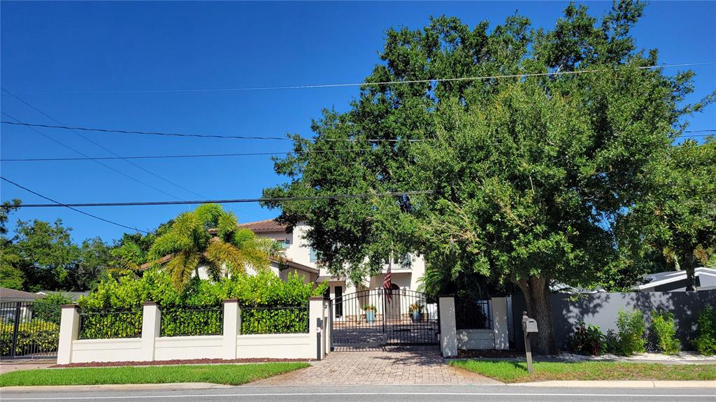 a view of a street with a building in the background