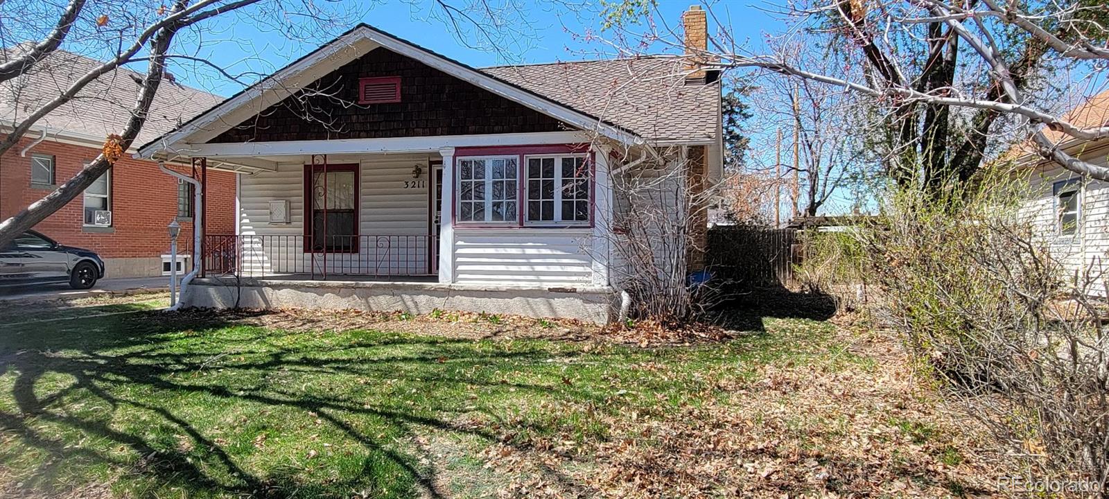 front view of a house with a yard