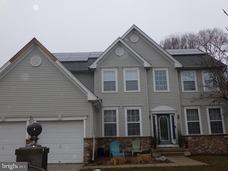 a front view of a house with garage