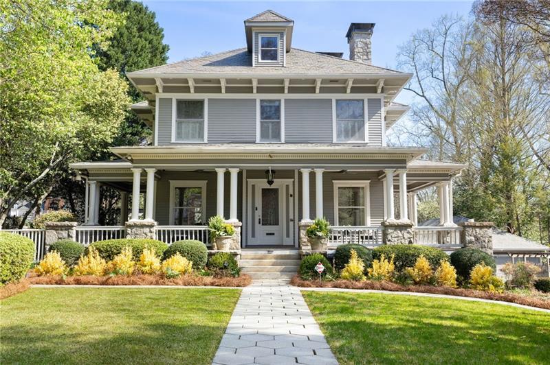 a front view of a house with a yard table and chairs