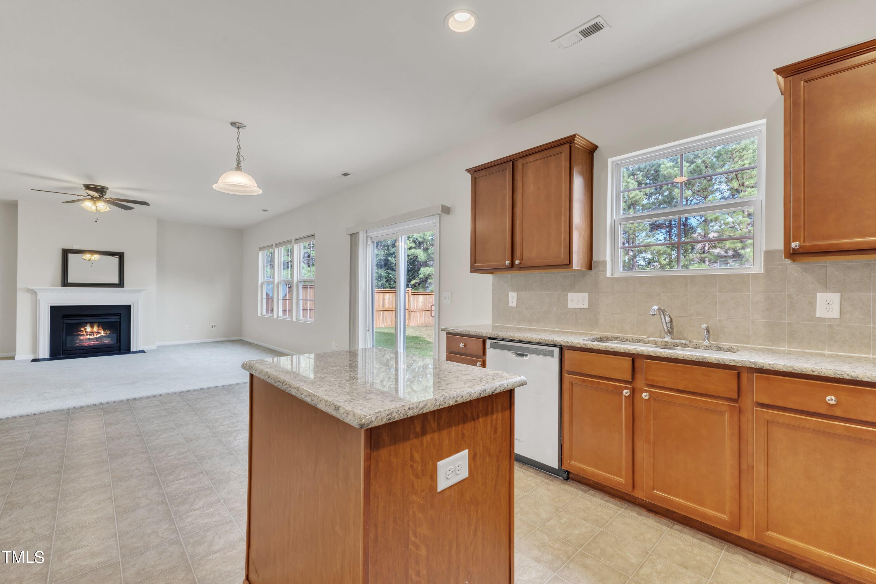 a kitchen with sink cabinets and window