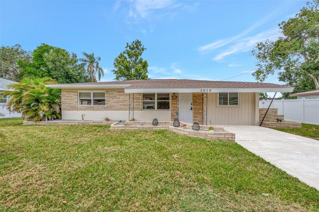 front view of a house with a yard