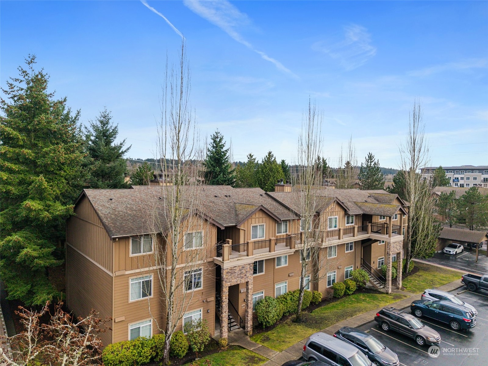 a view of multiple houses with a city view