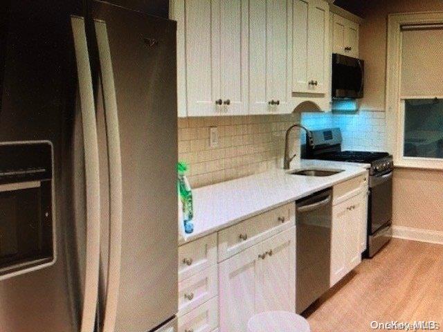 a view of a kitchen with appliances