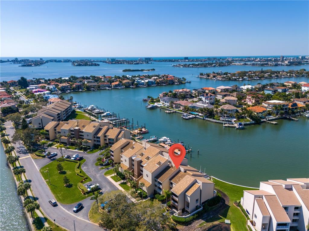 an aerial view of a house with a ocean view