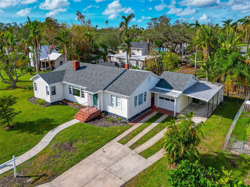 an aerial view of a house with a big yard