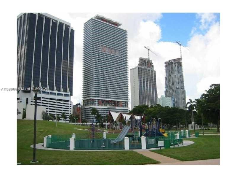 a view of a city with tall buildings