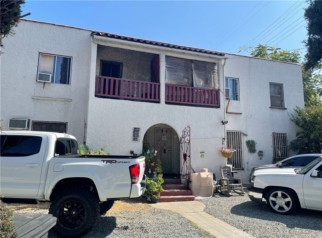 a front view of a house with parking space