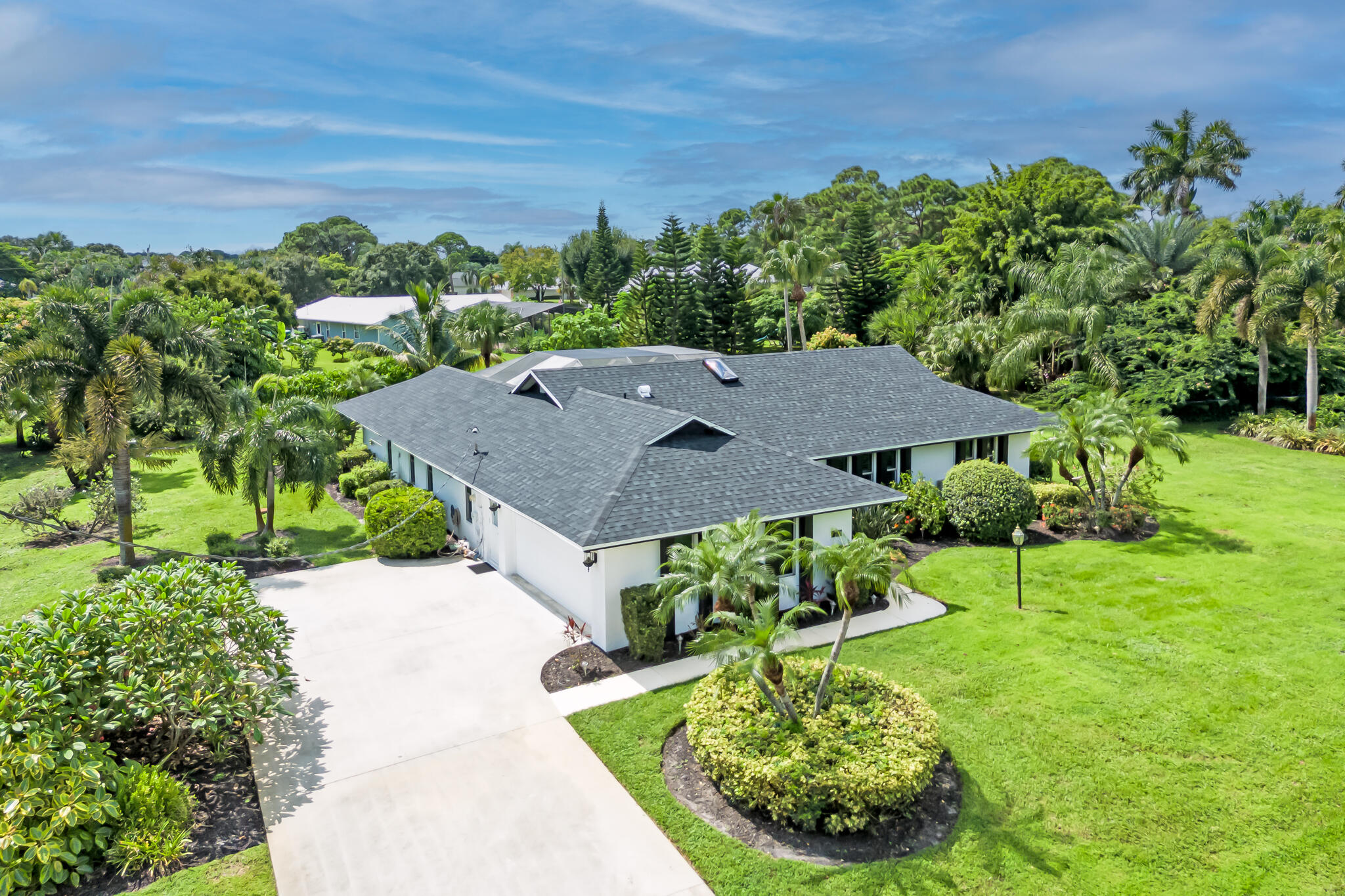 a aerial view of a house with a yard