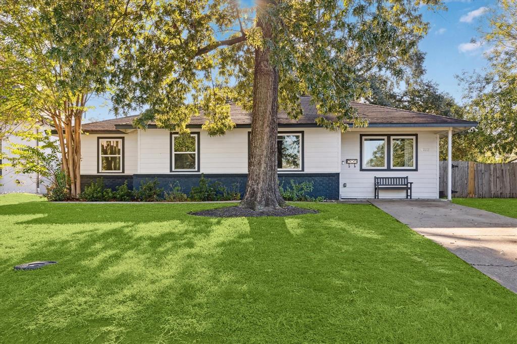 front view of a house with a yard