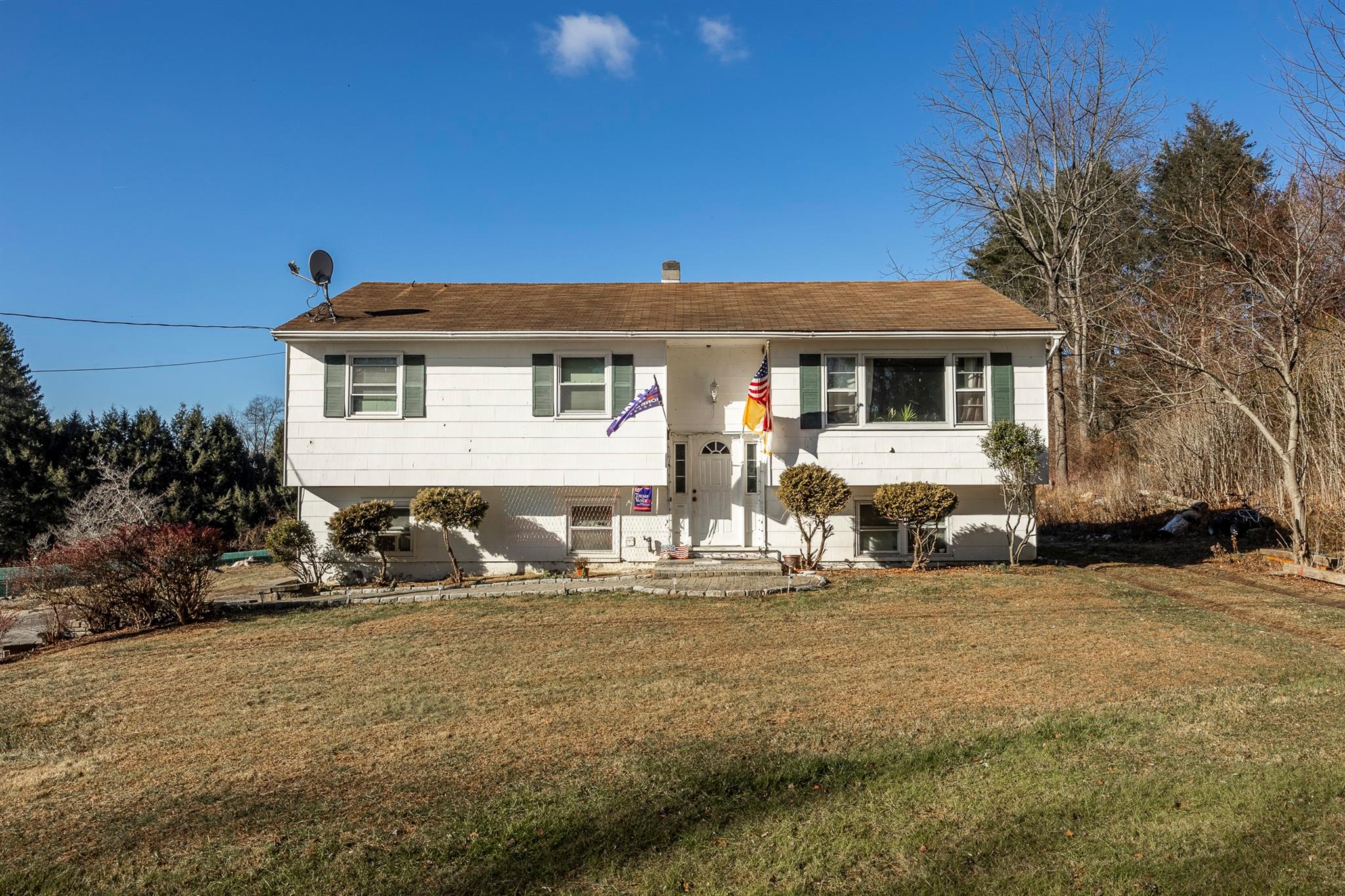 Split foyer home with a front lawn