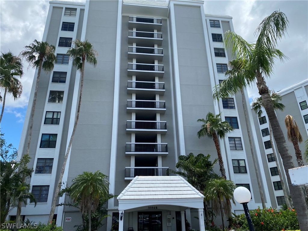 front view of a building with potted plants