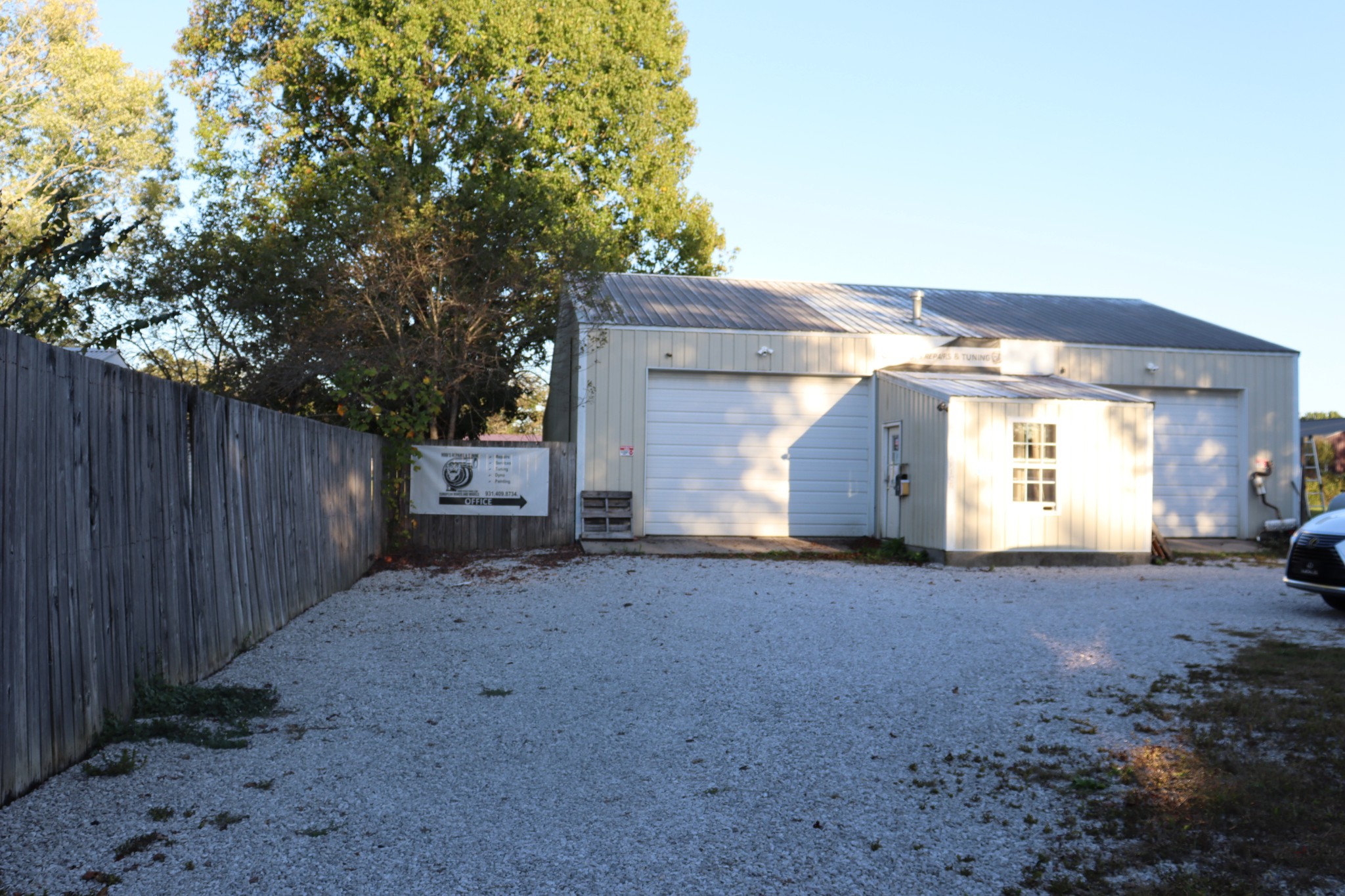 a view of a house with a yard and garage