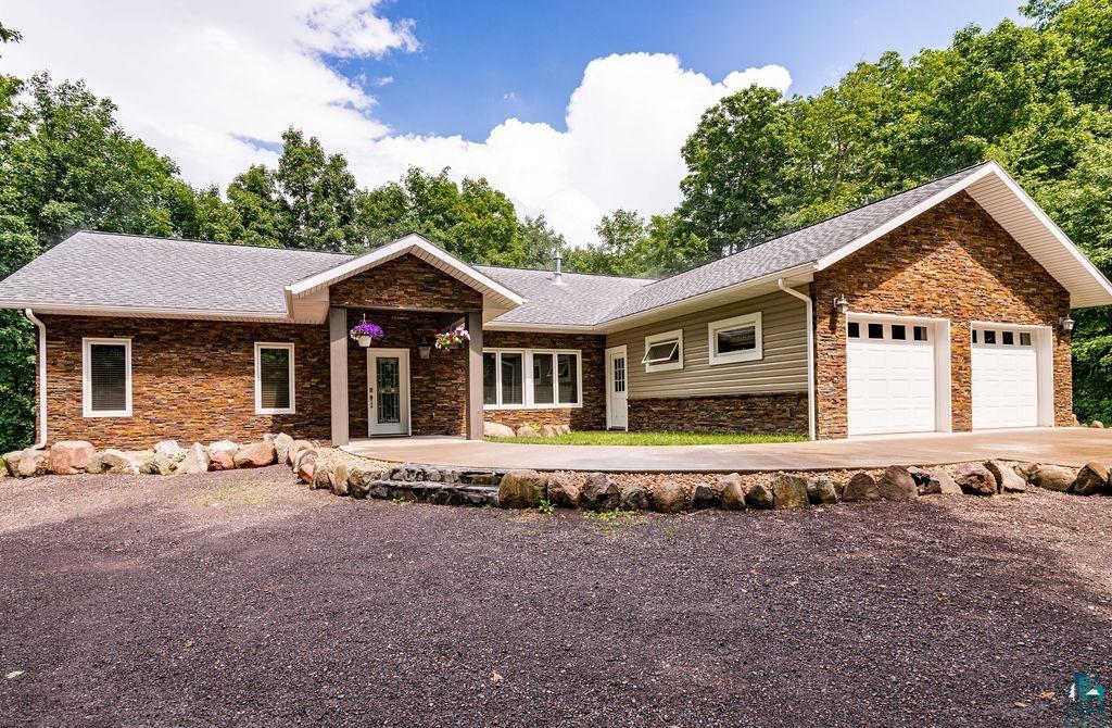 Ranch-style home featuring a garage