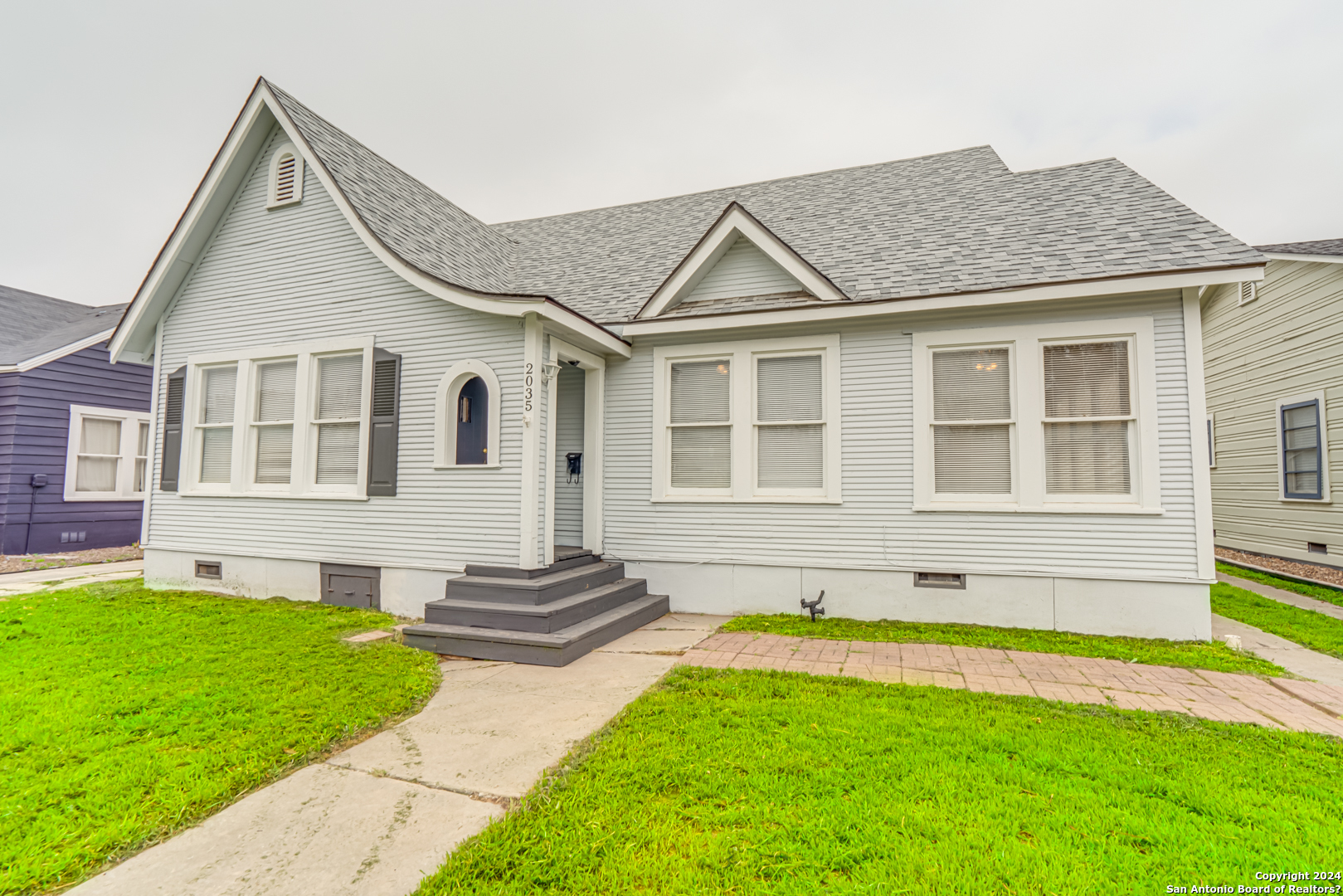 a front view of a house with a yard