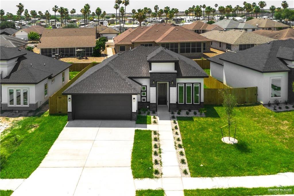 a aerial view of a house with a yard