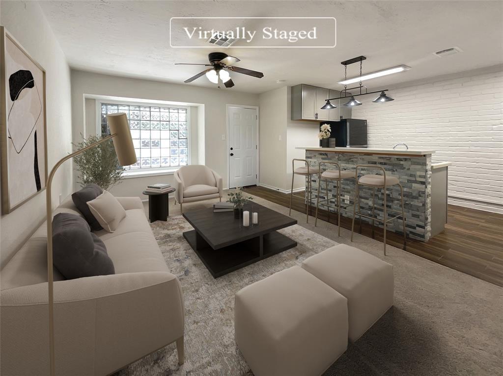 a living room with furniture and a window