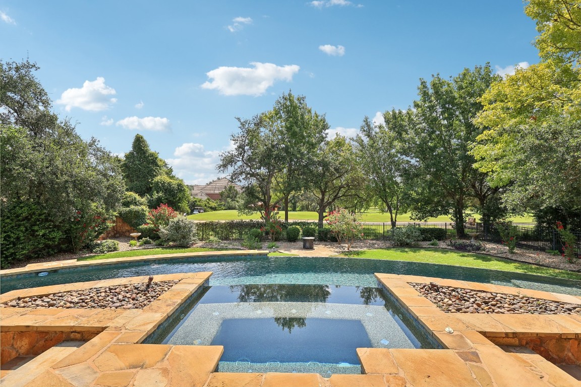 Stunning outdoor area with a negative edge pool.