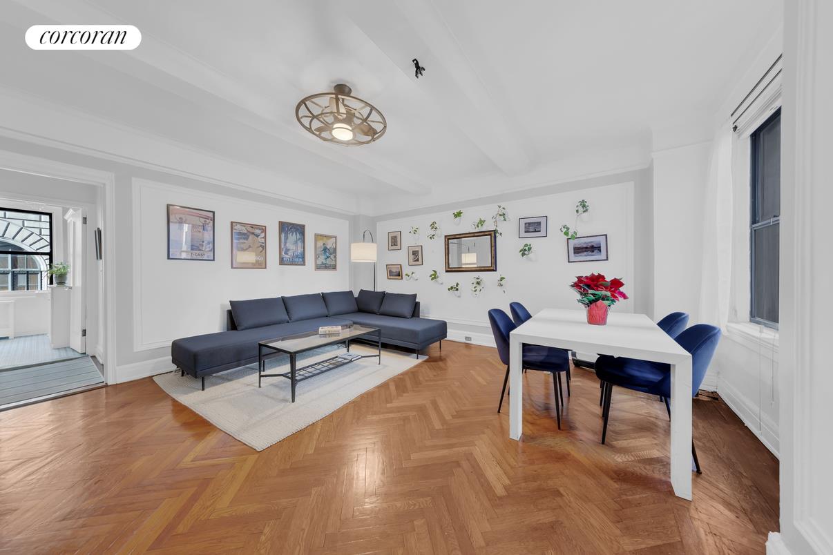 a living room with furniture and a table