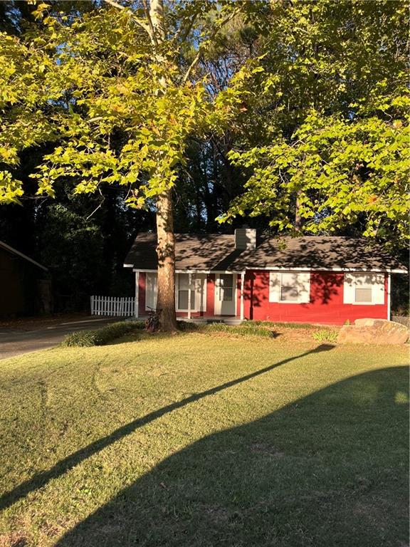 a view of the house with basketball court