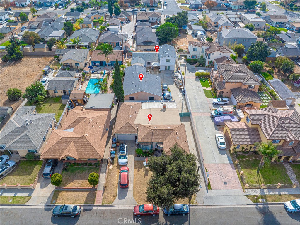 an aerial view of residential houses with outdoor space