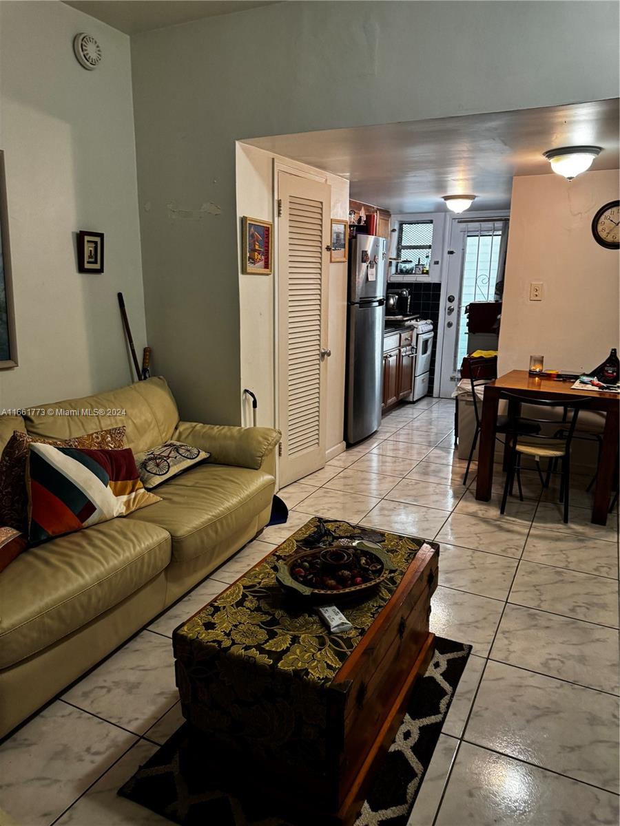 a living room with furniture and a table