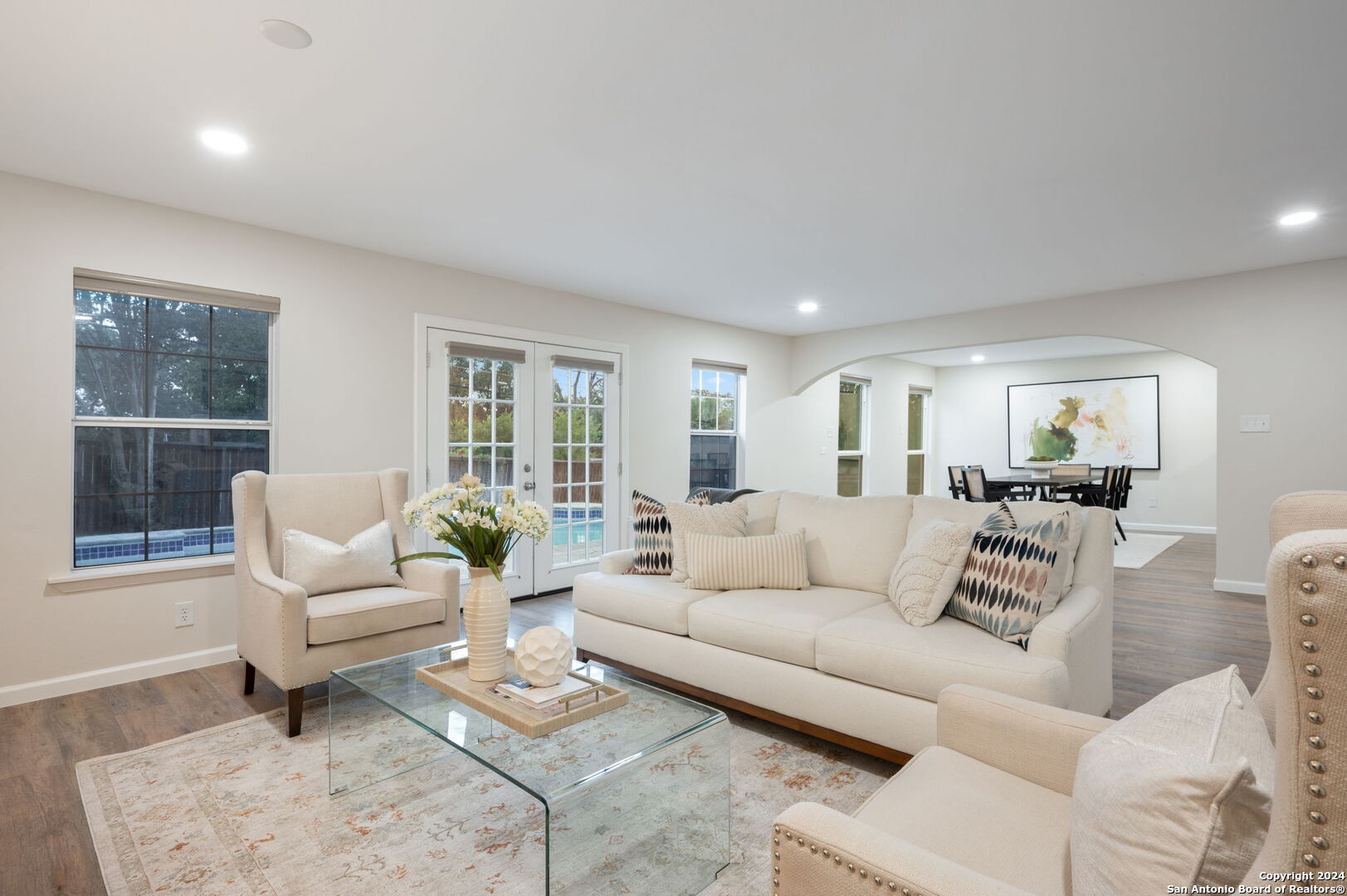 a living room with furniture and a large window