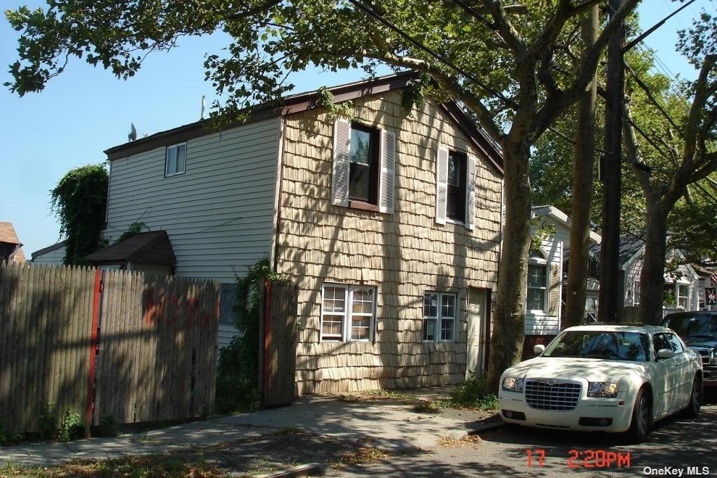 a car parked in front of a house