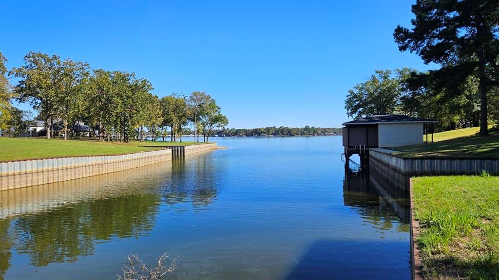 a view of a lake with a big yard