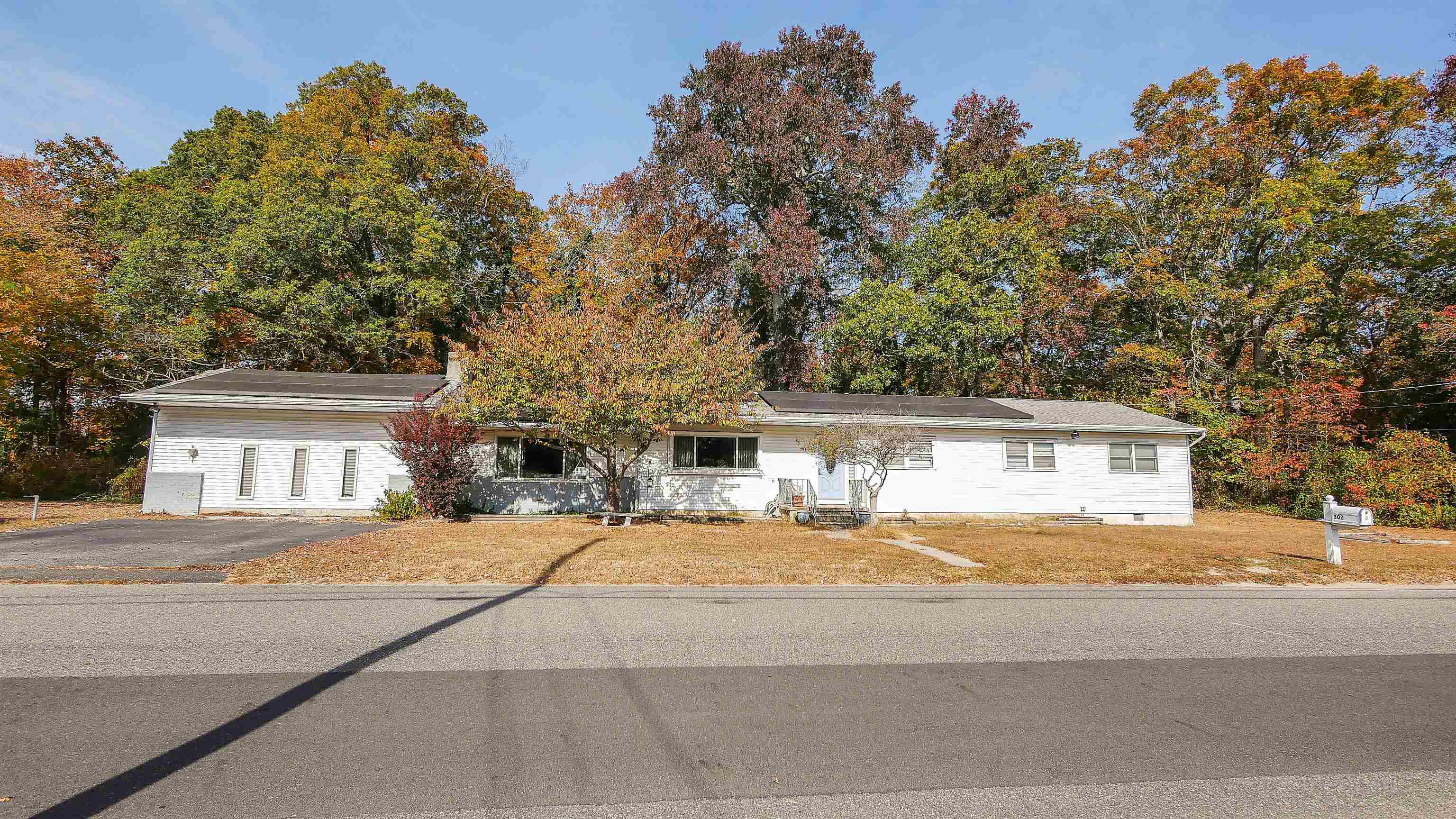 a house with trees in the background