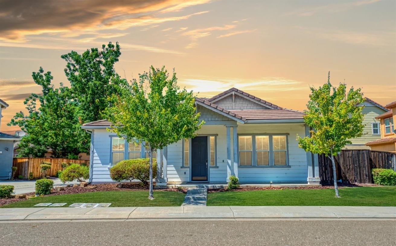 front view of a house with a yard