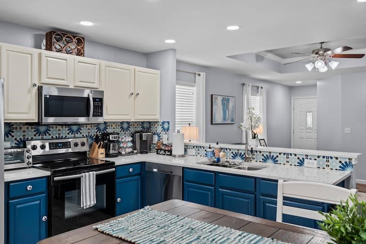 a kitchen with a sink stove and microwave