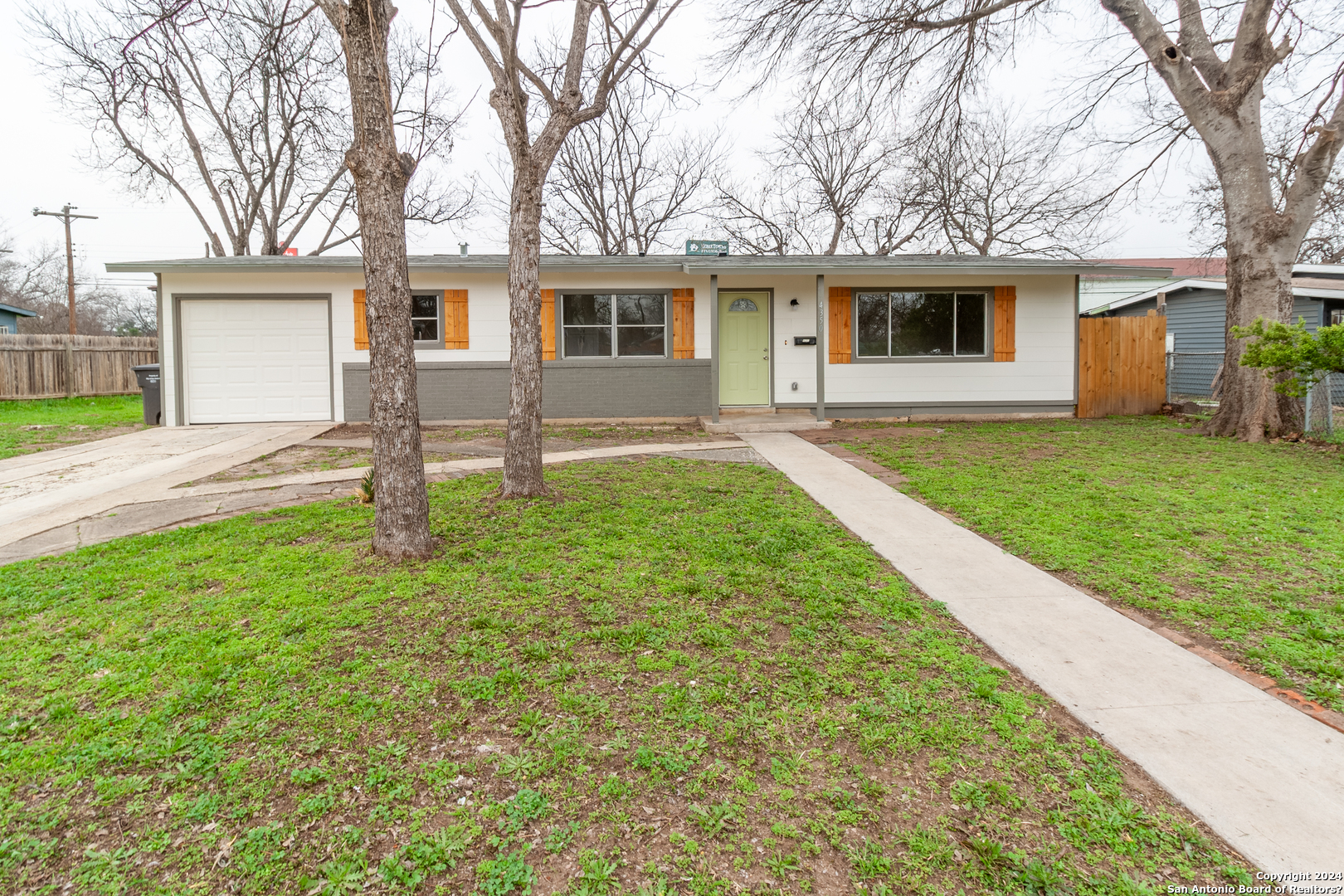 front view of a house with a yard