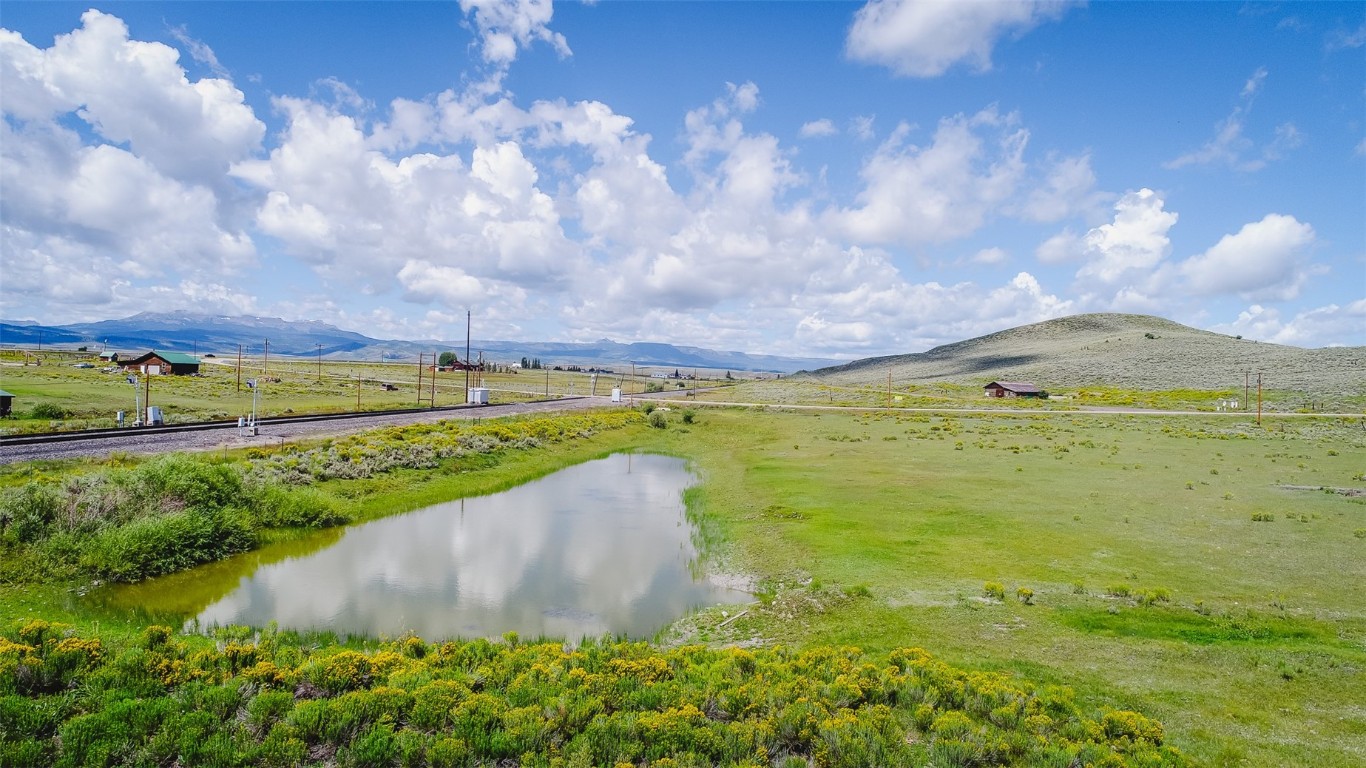 a view of a lake with a big yard