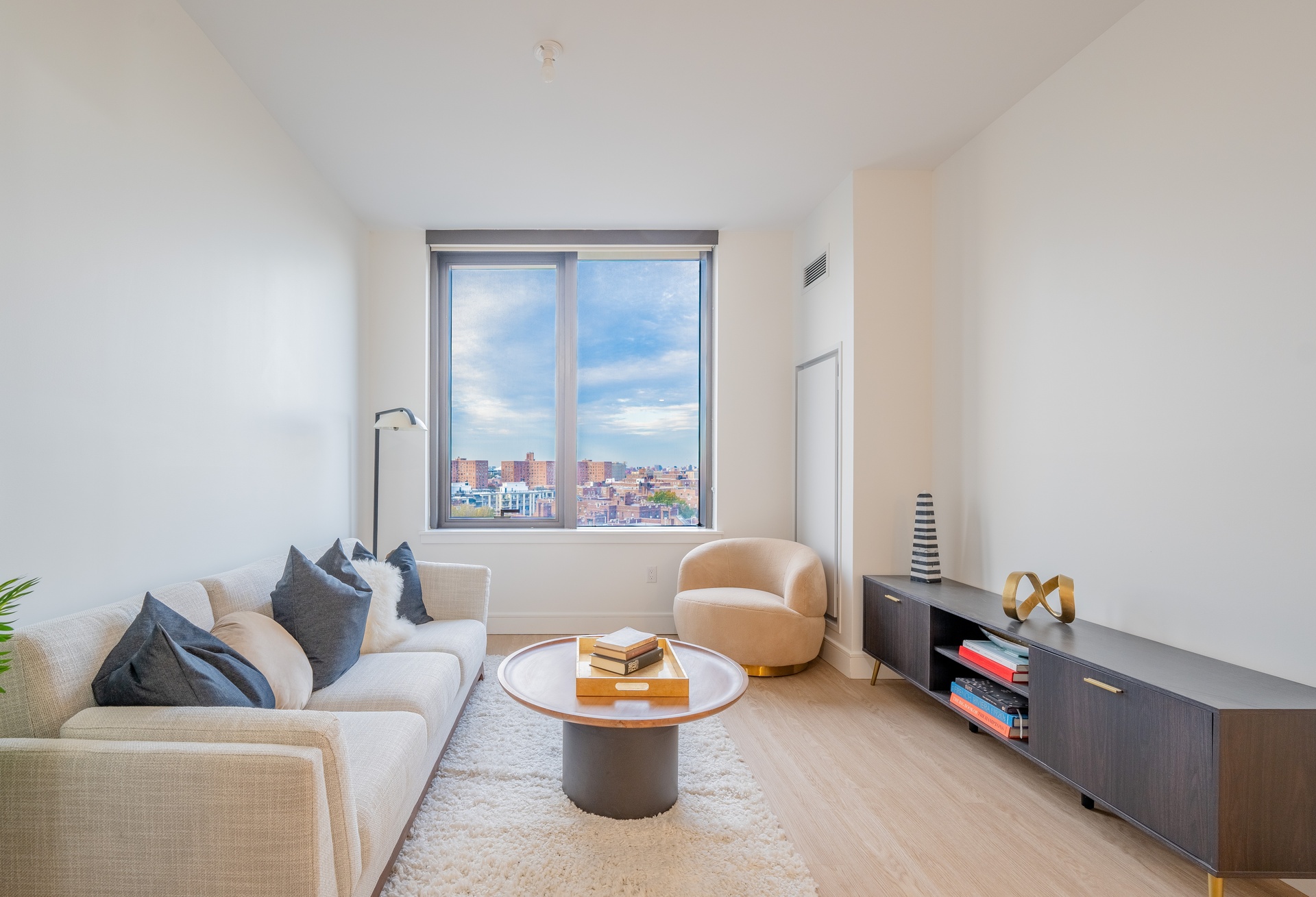 a living room with furniture and a window