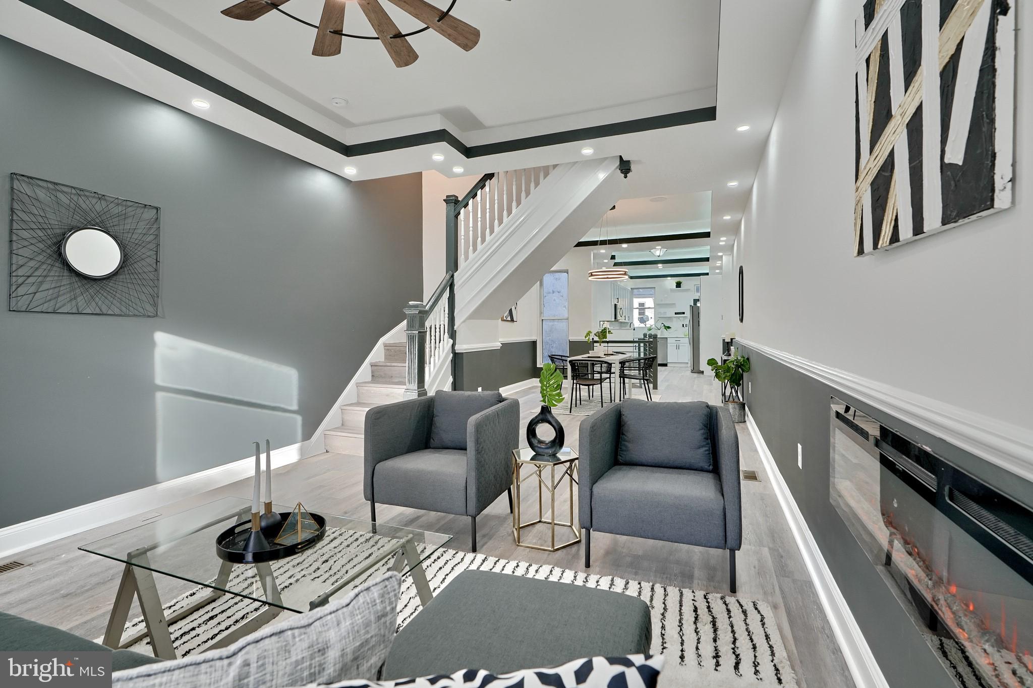 a living room with furniture and a rug