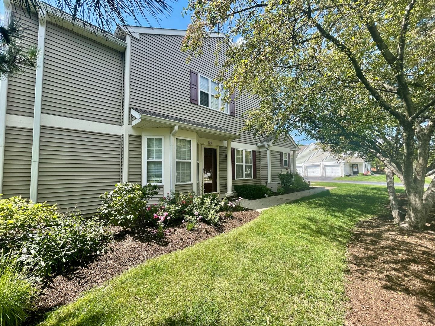 a front view of a house with garden