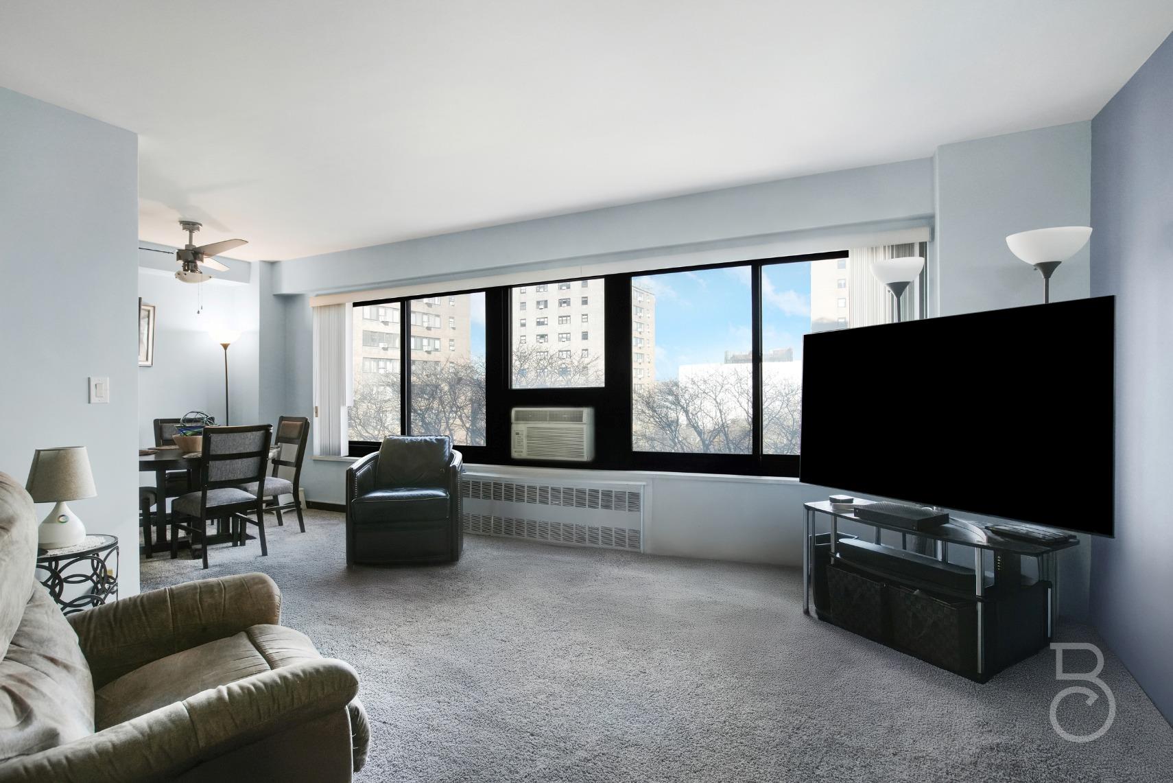 Spacious living room with a wall of windows