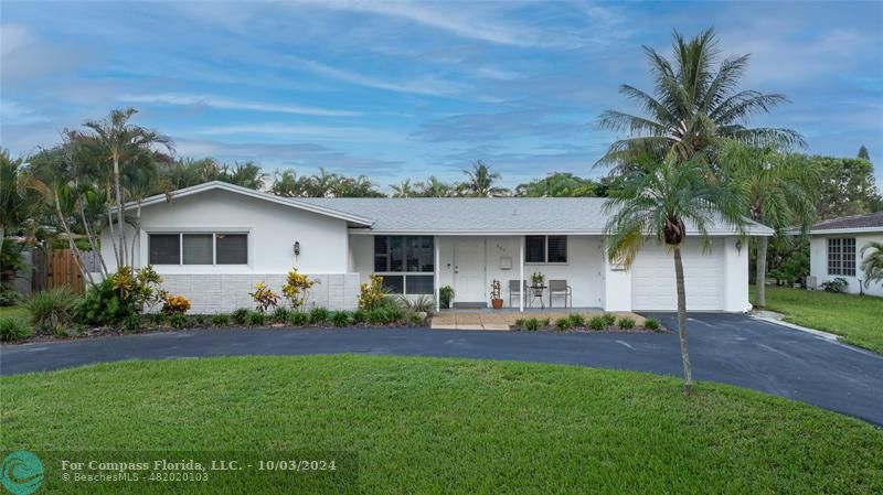 Front home facade with circular and straightaway drive (resurfaced), impact garage door, windows/doors, exterior paint, 2023 roof.