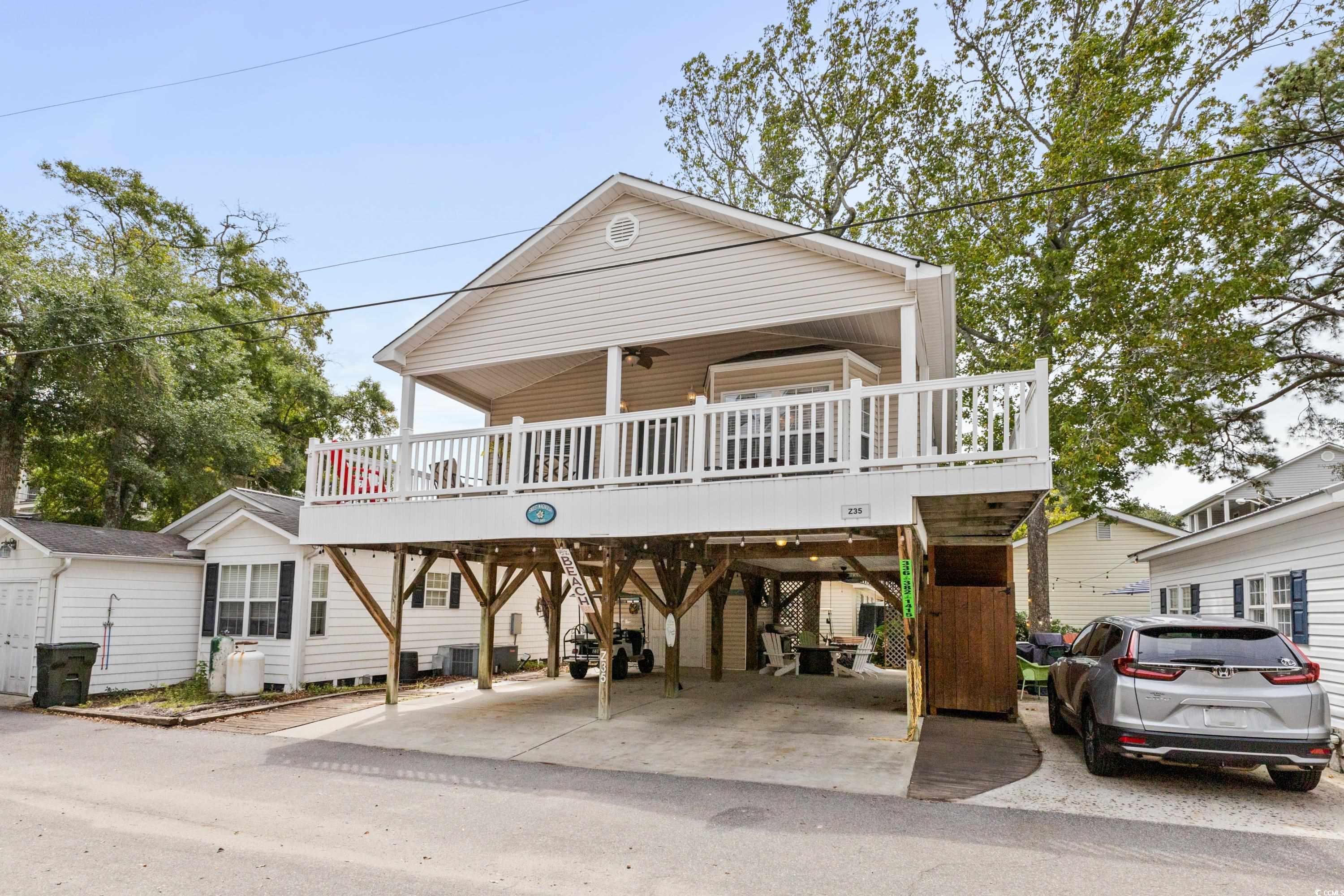 View of front of property with a carport