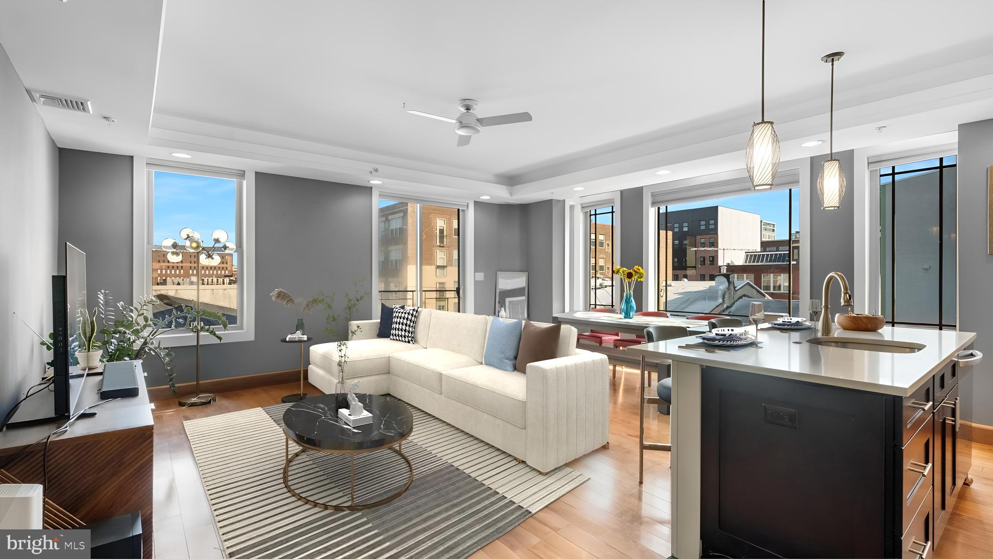 a living room with furniture and wooden floor